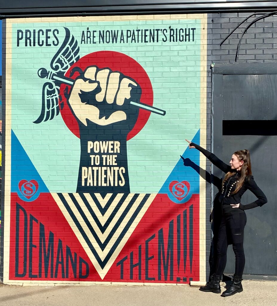mural depicting urgent message to control health care costs